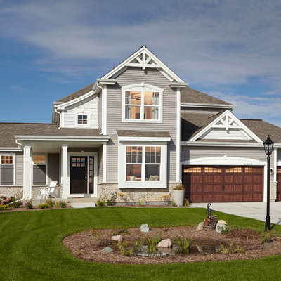 Mid-sized traditional gray two-story mixed siding exterior home idea in Milwaukee