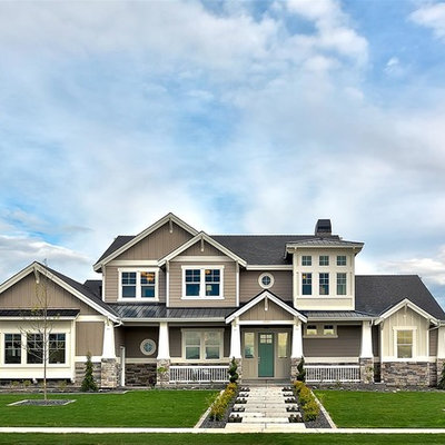 Large elegant brown two-story mixed siding gable roof photo in Boise