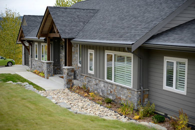 Inspiration for a mid-sized timeless gray mixed siding house exterior remodel in Other