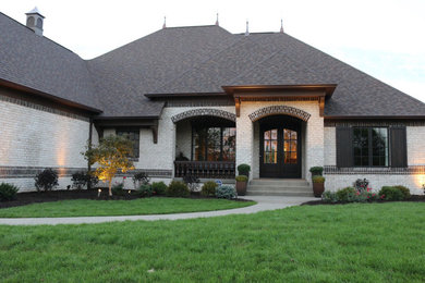 Inspiration for a mid-sized craftsman white two-story brick exterior home remodel in Indianapolis