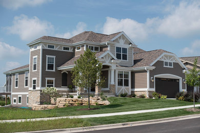 Inspiration for a craftsman beige two-story mixed siding exterior home remodel in Milwaukee