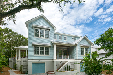 Large coastal blue three-story concrete fiberboard exterior home idea in Charleston