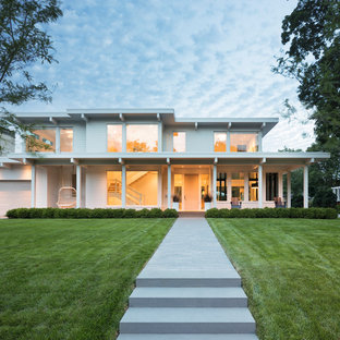 Inspiration for a contemporary white two-story flat roof remodel in Minneapolis
