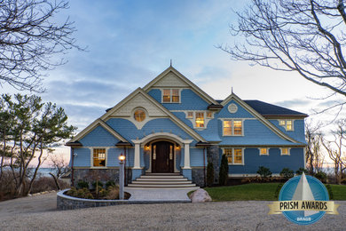 Blue house exterior photo in Boston with a shingle roof