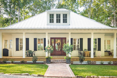 Inspiration for a large country white two-story concrete fiberboard house exterior remodel in Atlanta with a metal roof