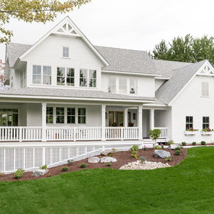 Traditional white two-story exterior home idea in Minneapolis with a shingle roof
