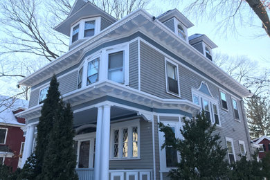 Example of a large arts and crafts exterior home design in Boston