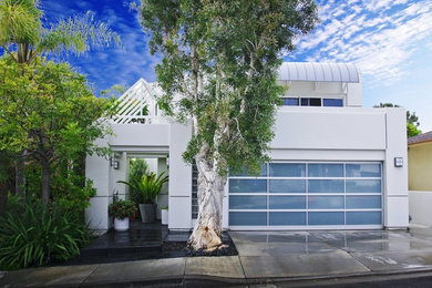 Trendy white exterior home photo in Orange County