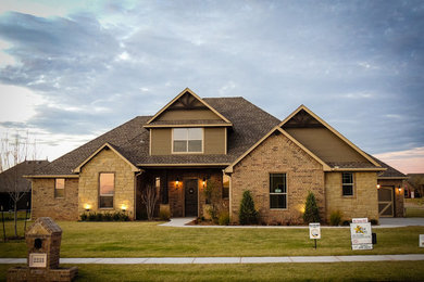 Inspiration for a mid-sized craftsman brown two-story brick gable roof remodel in Oklahoma City