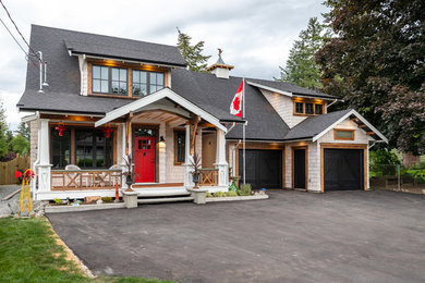 Mid-sized arts and crafts white two-story wood house exterior photo in Vancouver with a hip roof and a shingle roof