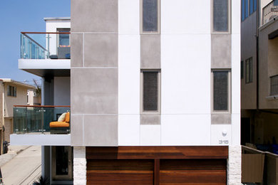 Example of a trendy concrete exterior home design in Los Angeles