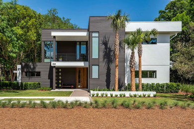 Zweistöckiges Modernes Einfamilienhaus mit Flachdach, Mix-Fassade und bunter Fassadenfarbe in Orlando
