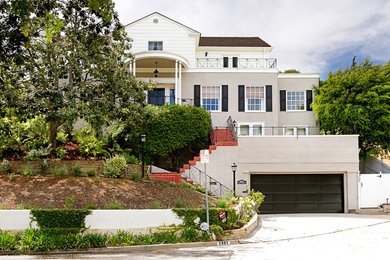 Large and beige traditional render detached house in Los Angeles with three floors, a pitched roof and a shingle roof.