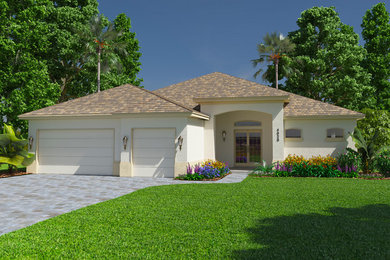 Example of a large tuscan beige one-story stucco house exterior design in Other with a hip roof and a tile roof