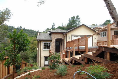 Large arts and crafts beige split-level mixed siding exterior home photo in San Francisco