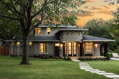 Example of a transitional gray two-story concrete fiberboard exterior home design in Austin