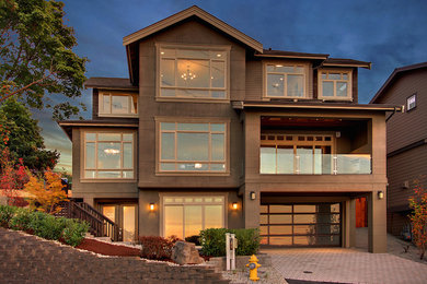 Example of a classic three-story exterior home design in Seattle