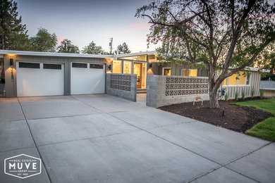 Example of a large trendy gray one-story concrete exterior home design in Salt Lake City