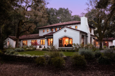 Inspiration for a large timeless white two-story stucco exterior home remodel in San Francisco