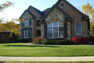 Example of a classic two-story mixed siding exterior home design in Indianapolis