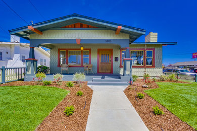 Inspiration for a mid-sized craftsman green one-story wood exterior home remodel in San Diego