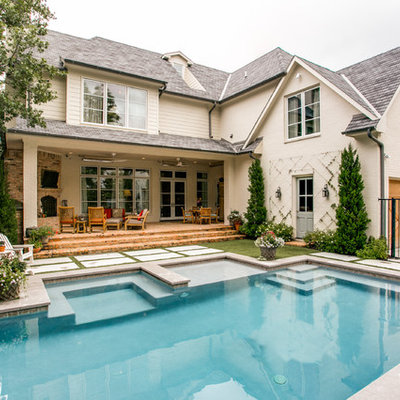 Huge elegant white three-story brick exterior home photo in Dallas