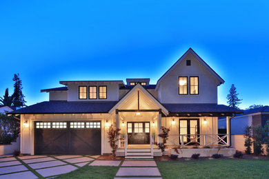 Example of a mid-sized country white two-story wood gable roof design in Los Angeles