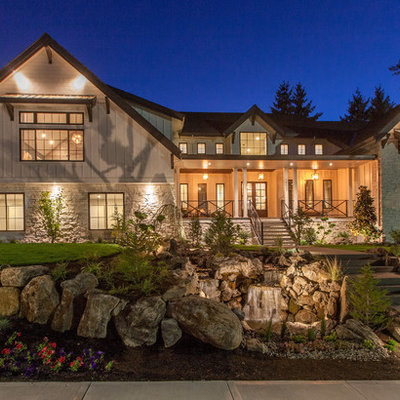 Example of a large farmhouse white two-story mixed siding exterior home design in Portland with a mixed material roof