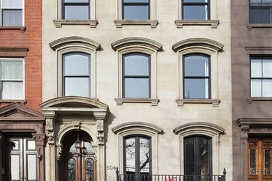 Elegant beige three-story exterior home photo in New York