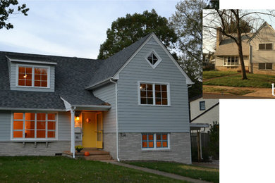 Modelo de fachada gris tradicional renovada de tamaño medio a niveles con revestimiento de aglomerado de cemento y tejado a dos aguas