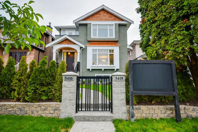 Example of a mid-sized arts and crafts green two-story stucco exterior home design in Vancouver with a shingle roof