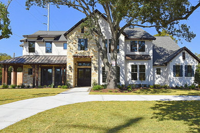 Inspiration for a classic two floor house exterior in Houston.