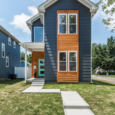 Example of a transitional blue two-story wood exterior home design in Indianapolis
