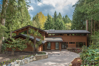 Inspiration for a rustic two-story wood gable roof remodel in Vancouver