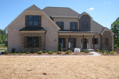 Example of an arts and crafts exterior home design in Raleigh