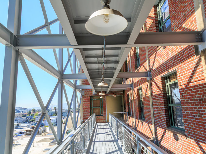 An enormous urban three-story brick exterior home design as an example