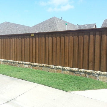 6 ft. Cedar Fence with Stone Retaining Wall