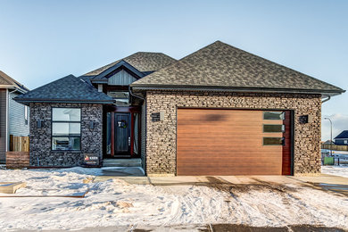 Example of a transitional exterior home design in Calgary