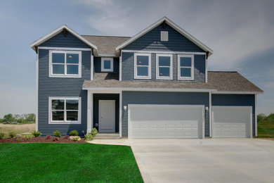 Example of a transitional exterior home design in Grand Rapids