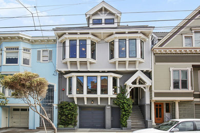 Example of a transitional gray three-story exterior home design in San Francisco