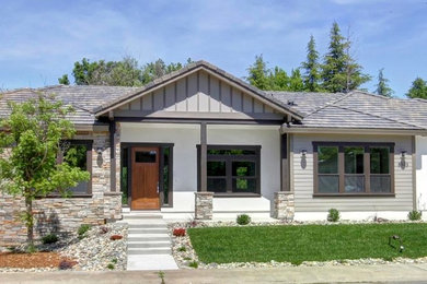 Design ideas for a small and beige contemporary bungalow detached house in Sacramento with mixed cladding, a pitched roof and a tiled roof.