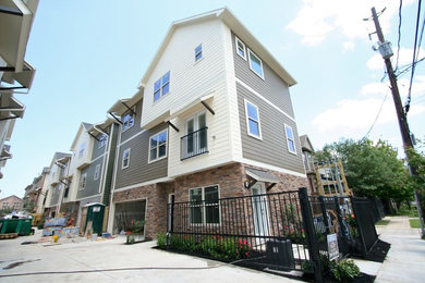 Traditional brown three-story concrete fiberboard exterior home idea in Houston