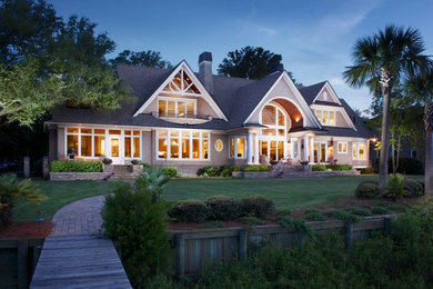 Inspiration for a large and beige classic two floor detached house in Charleston with a pitched roof, wood cladding and a shingle roof.