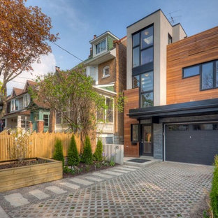 Design ideas for a contemporary exterior in Toronto with wood siding.