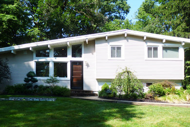 Example of a 1950s exterior home design in New York