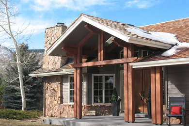Example of a mid-sized mountain style gray one-story mixed siding gable roof design in Denver