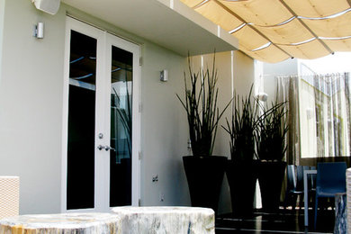 Example of a minimalist exterior home design in Miami