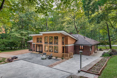 Example of a minimalist wood exterior home design in Nashville