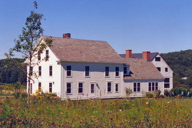 Inspiration for a large farmhouse white three-story mixed siding exterior home remodel in Boston