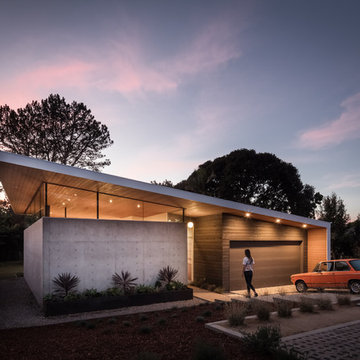 Aa House : Concrete formed walls with Clerestory glass and Cedar siding